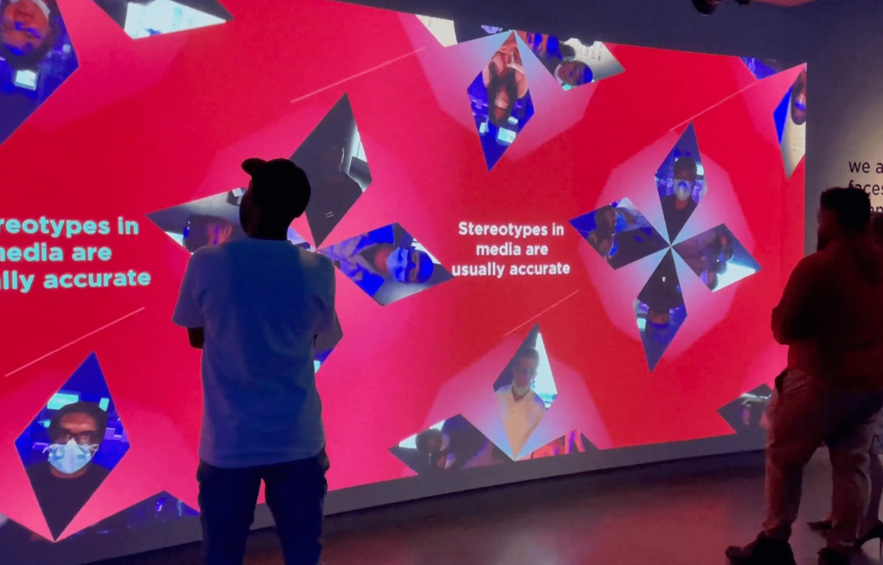 Visitors look at their self-portraits combine to build thought-provoking visuals at the Digital Kaleidoscope section.