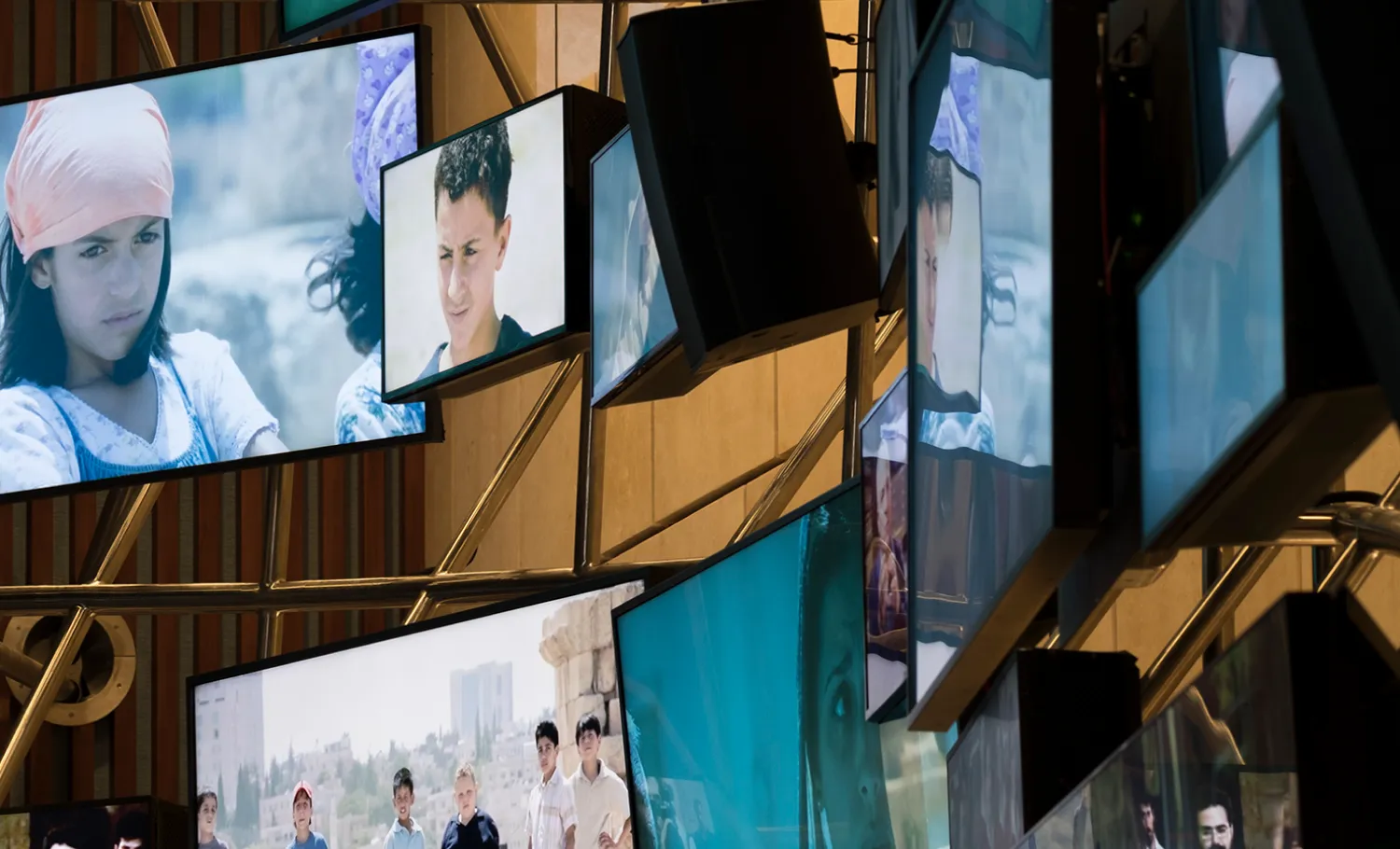 Number of screens play scenes from notable Arab film throughout history.
