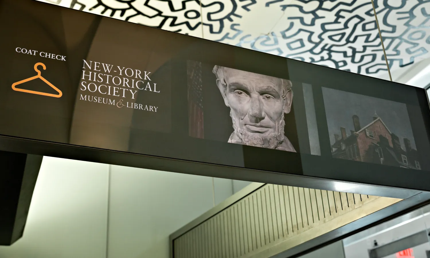 Digital informational banner presenting directions to the museum's exhibits and facilities.
