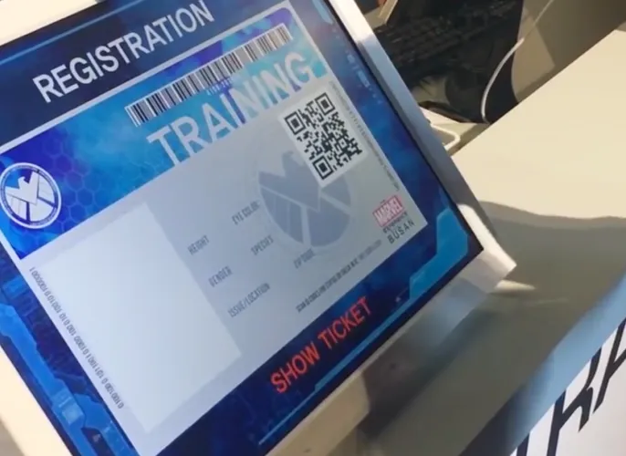 A digital kiosk screen showing the registration process upon entering the exhibition.